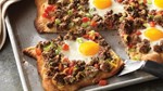 Photo of beef recipe featuring beef, eggs, peppers, and bread.